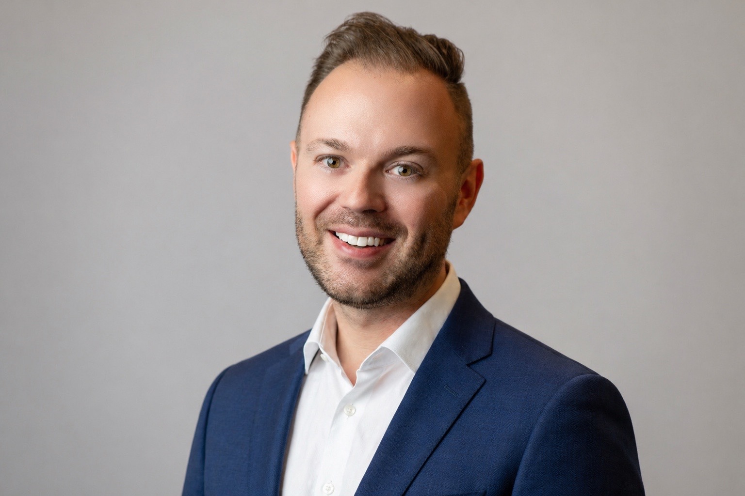 Andrew P. Robinson in a navy suit